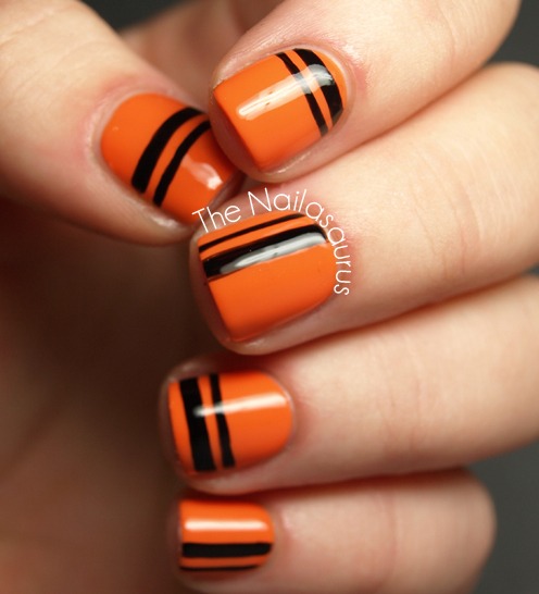 Orange and black stripes nail art for Halloween